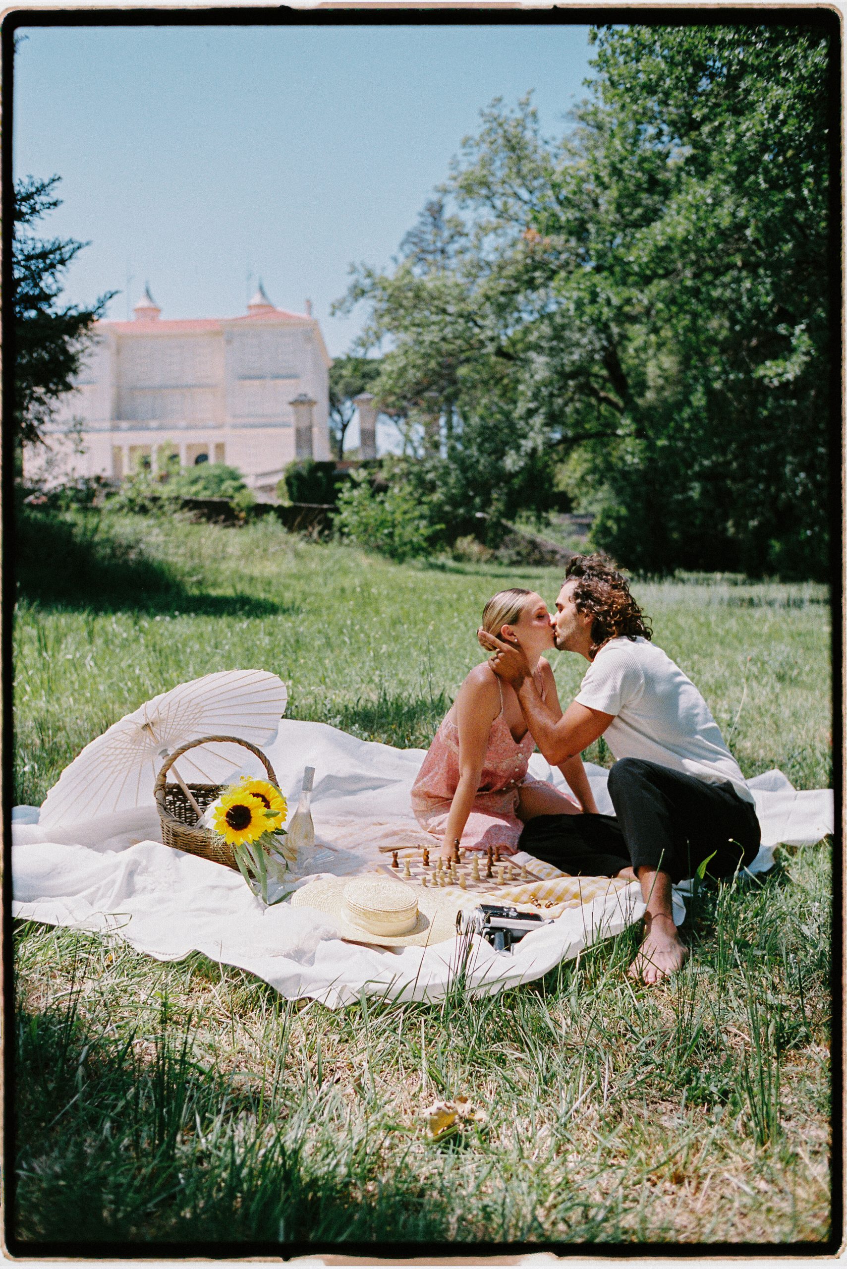 A couple enjoying a picnic in a garden at a wedding in Provence